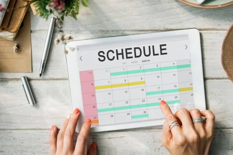 Calendar schedule with womans hands