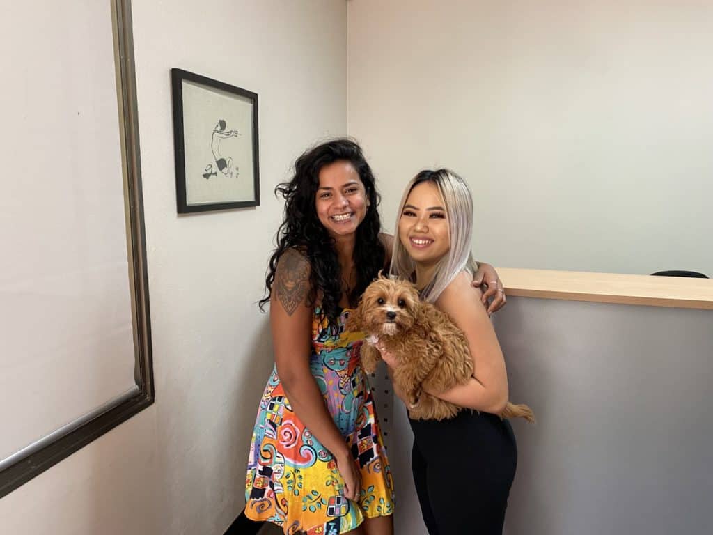 Our Interns Naomi (left) and Joanna (right) with our unofficial office mascot Tilly! 